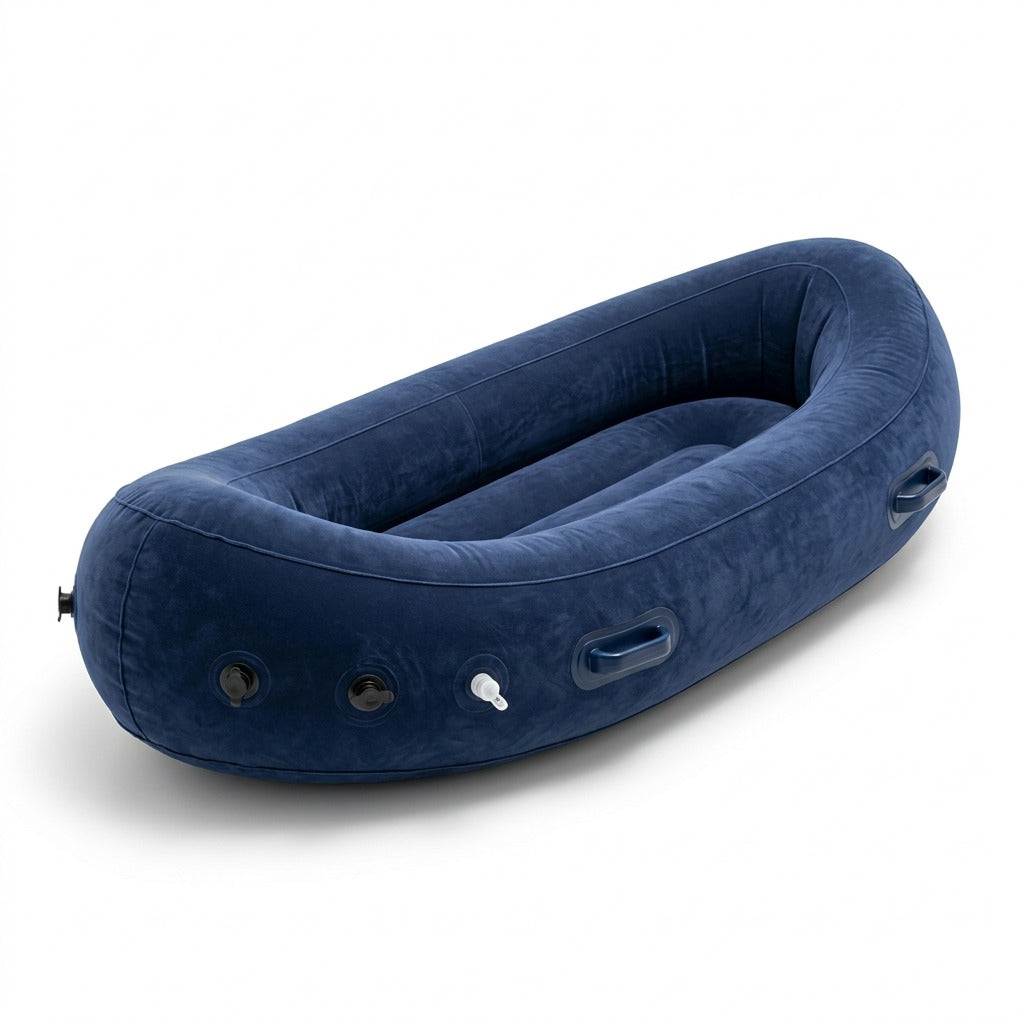 Blue fdmt inflatable Peapod sensory chair with velvet-like texture and side handles on white back.