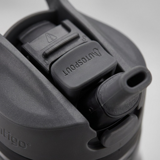 A macro photo of the dark gray Contigo Autospout water bottle, highlighting the AUTOSPOUT pop-up button.