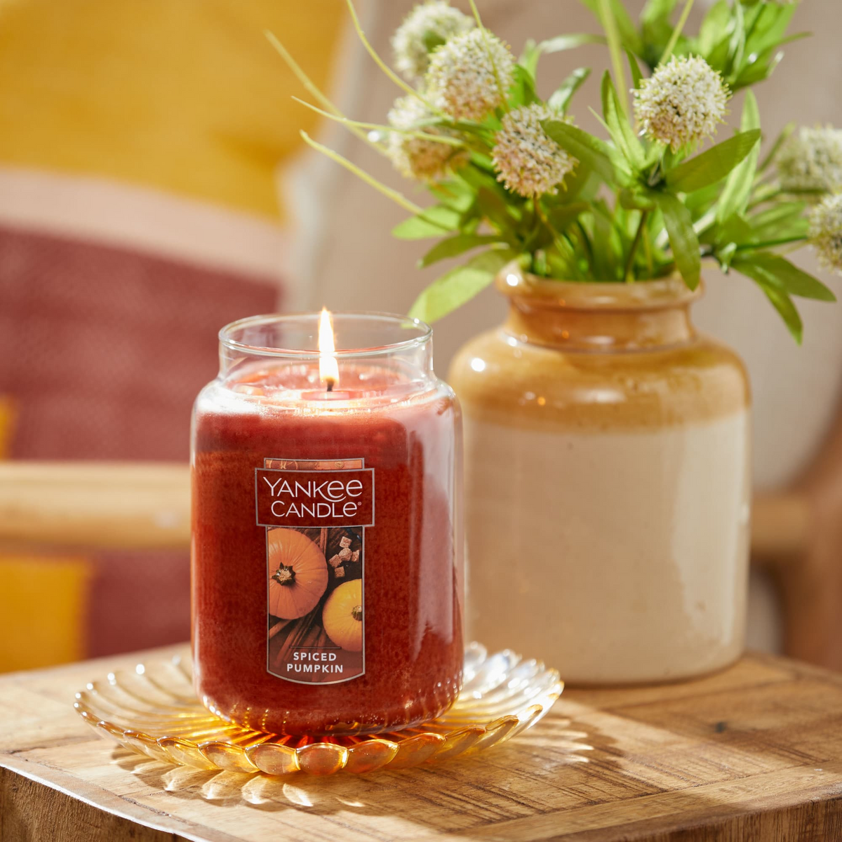 Yankee Candle Spiced Pumpkin Large Jar lit on a side table