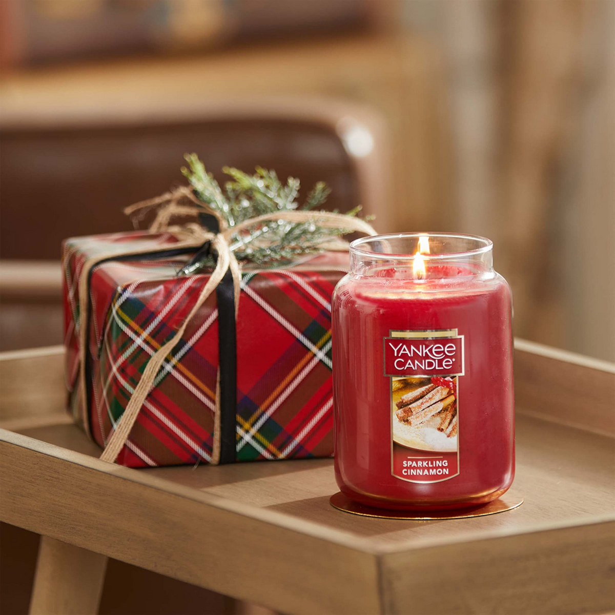 Yankee Candle Sparkling Cinnamon Large Jar beside a wrapped gift